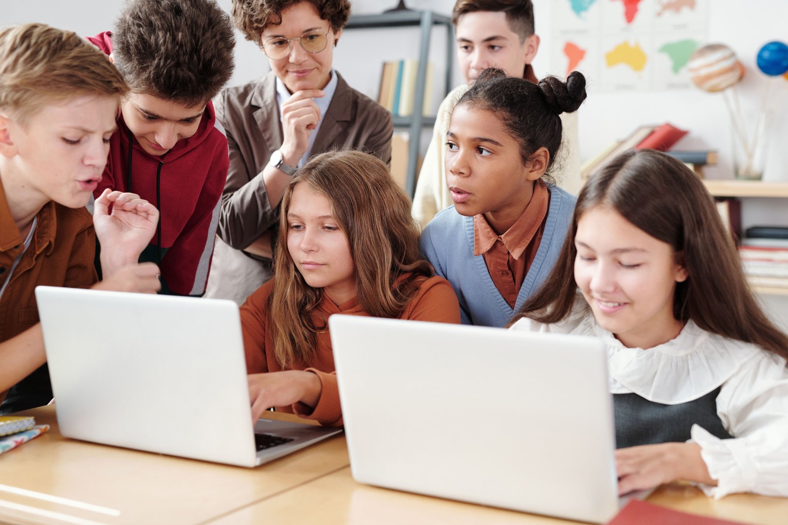 Students collaborating with technology in a classroom